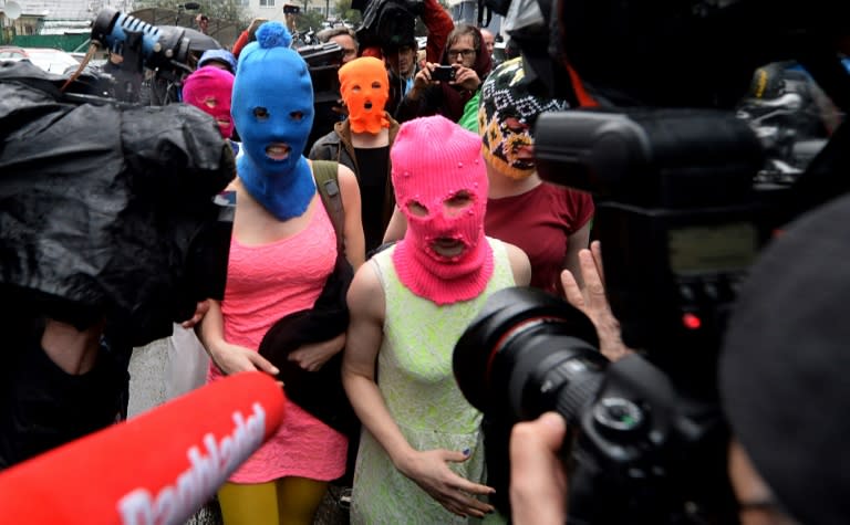 Russian punk group Pussy Riot members Nadezhda Tolokonnikova (L) and Maria Alyokhina (R) were among three convicted of hooliganism