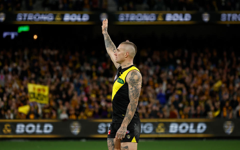 MELBOURNE, AUSTRALIA - JUNE 15: Dustin Martin of the Tigers recognises the crowd after his 300th match during the 2024 AFL Round 14 match between the Richmond Tigers and the Hawthorn Hawks at The Melbourne Cricket Ground on June 15, 2024 in Melbourne, Australia. (Photo by Michael Willson/AFL Photos via Getty Images)