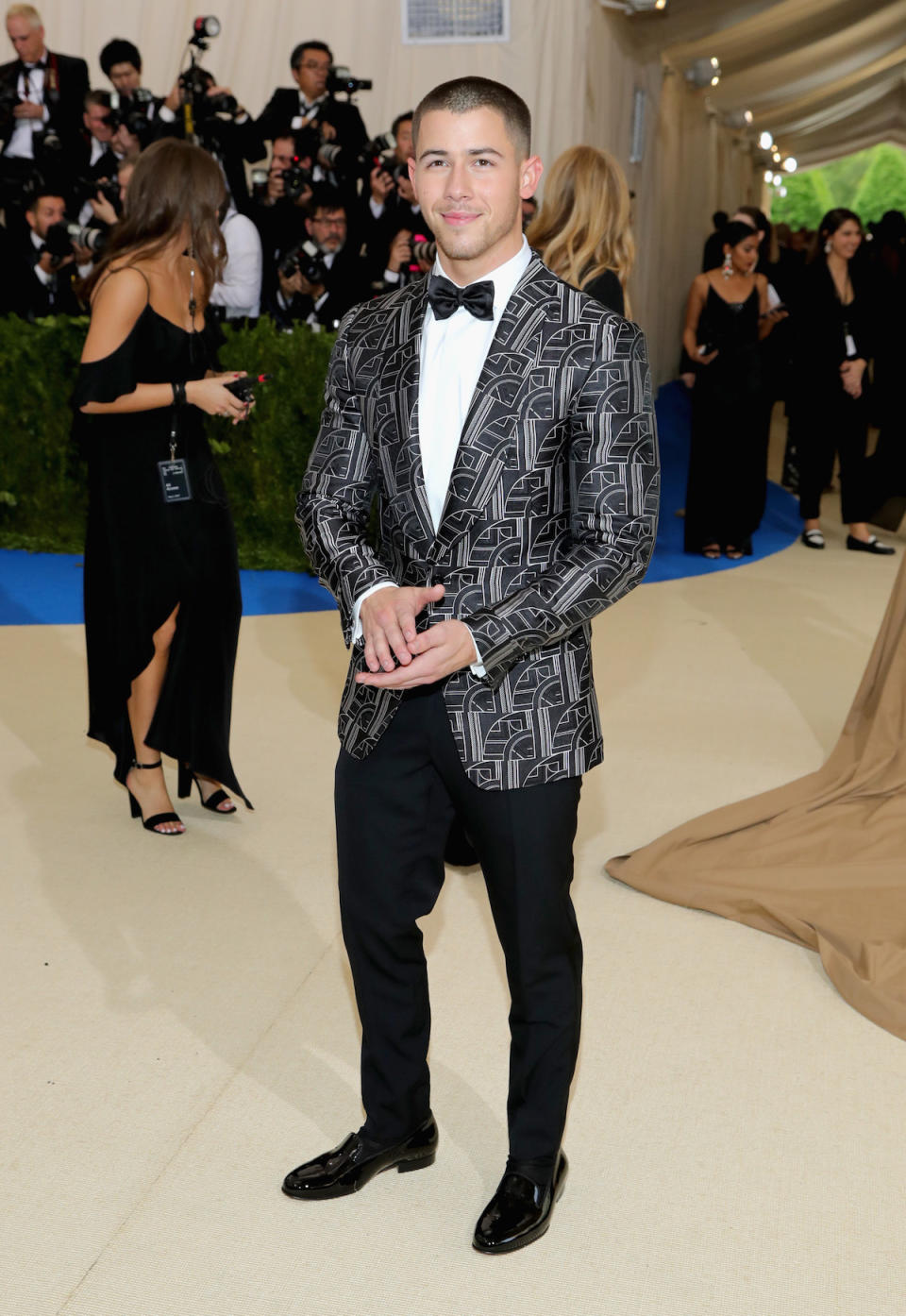 <p>The singer wore a black and white tuxedo jacket from Ralph Lauren Purple Label with black tuxedo pants to the 2017 Met Gala. (Photo by Neilson Barnard/Getty Images) </p>