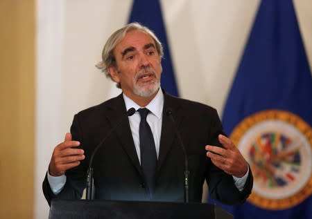 OAS special envoy Porto speaks during the signing of an agreement to create CICIES in San Salvador