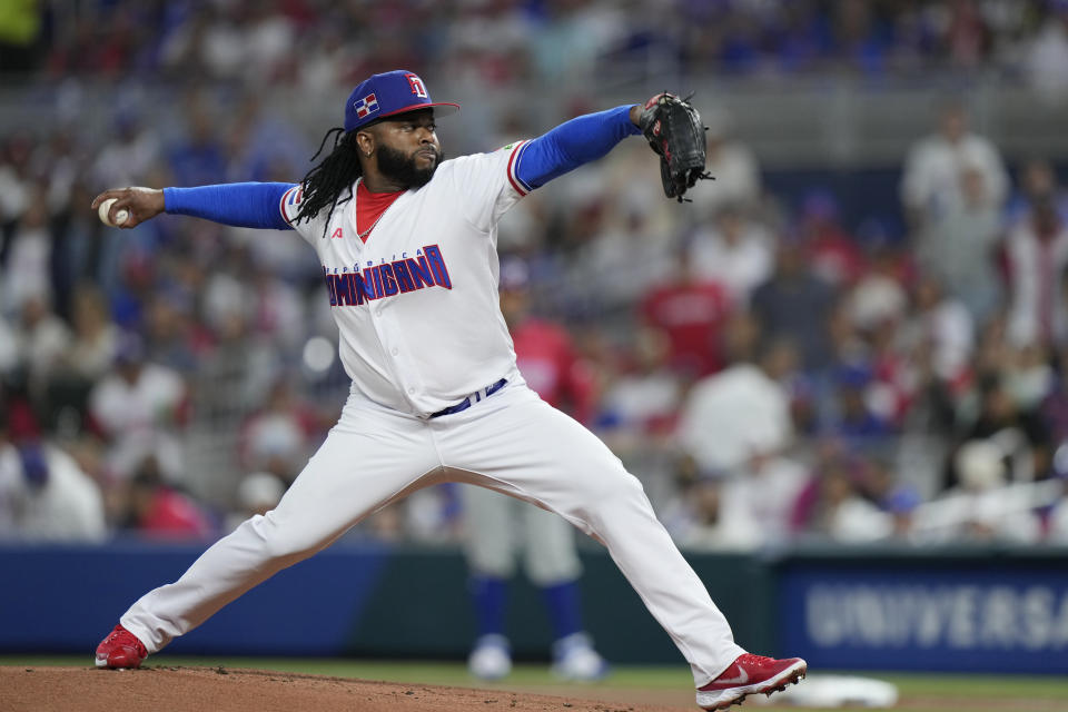 Dominican Republic's Johnny Cueto delivers a pitch during the first inning of a World Baseball Classic game against Puerto Rico, Wednesday, March 15, 2023, in Miami. (AP Photo/Wilfredo Lee)