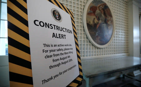 A sign in the Palm Room warns of the closure of the West Wing of the White House due to construction during renovations in Washington - Credit: Reuters