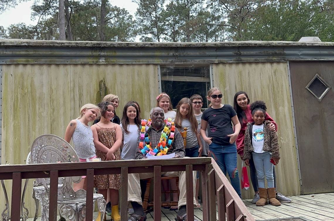 Students from Daufuskie Island’s elementary school visited Cleveland Bryan on Saturday, wishing him an early happy birthday with a handmade chain of paper messages. At 98, Bryan is Daufuskie Island’s oldest living resident.