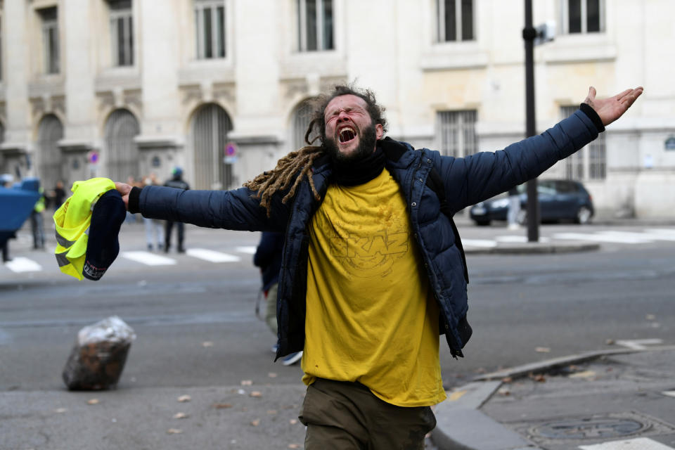 A yellow vest protester reacts during clashes with police at a national day of protest by the “yellow vests” movement in Paris, France, Dec. 8, 2018. (Photo: Piroschka van de Wouw/Reuters)