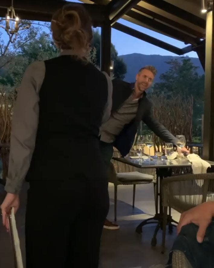 Screenshot of waitress asking Lofthouse to leave restaurant.