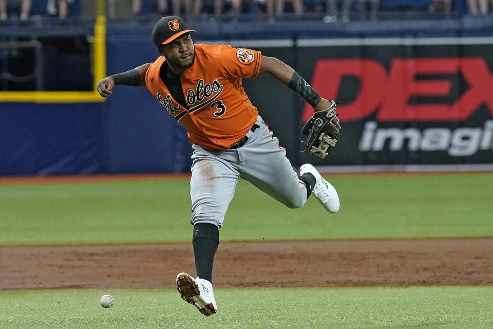 Baltimore Orioles third baseman Maikel Franco can't make the play on an infield single by Tampa Bay Rays' Manuel Margot during the first inning of a baseball game Saturday, June 12, 2021, in St. Petersburg, Fla. (AP Photo/Chris O'Meara)