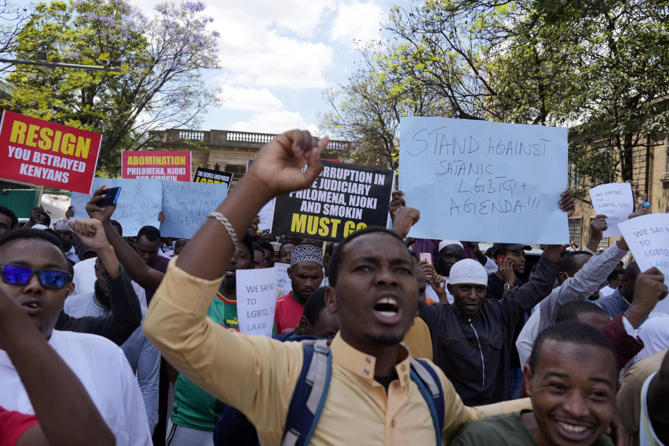 People hold placards as they chant slogan during a protest against a ruling by the Kenya supreme court for upholding the National Gay and Lesbian Human Rights Commission (NGLHRC) to register the association in Nairobi, Friday Oct. 6 2023. The protests took place after the Friday prayers with demonstrator’s calling out Kenya’s highest court for “condoning immorality.” (AP Photo/Khalil Senosi)