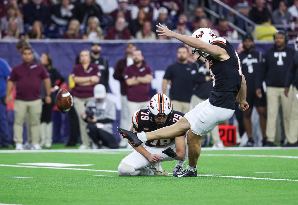 Dec 27, 2023; Houston, TX, USA; Oklahoma State Cowboys place kicker Alex Hale (19) makes a field goal during the first quarter against the Texas A&M Aggies at NRG Stadium. Mandatory Credit: Troy Taormina-USA TODAY Sports