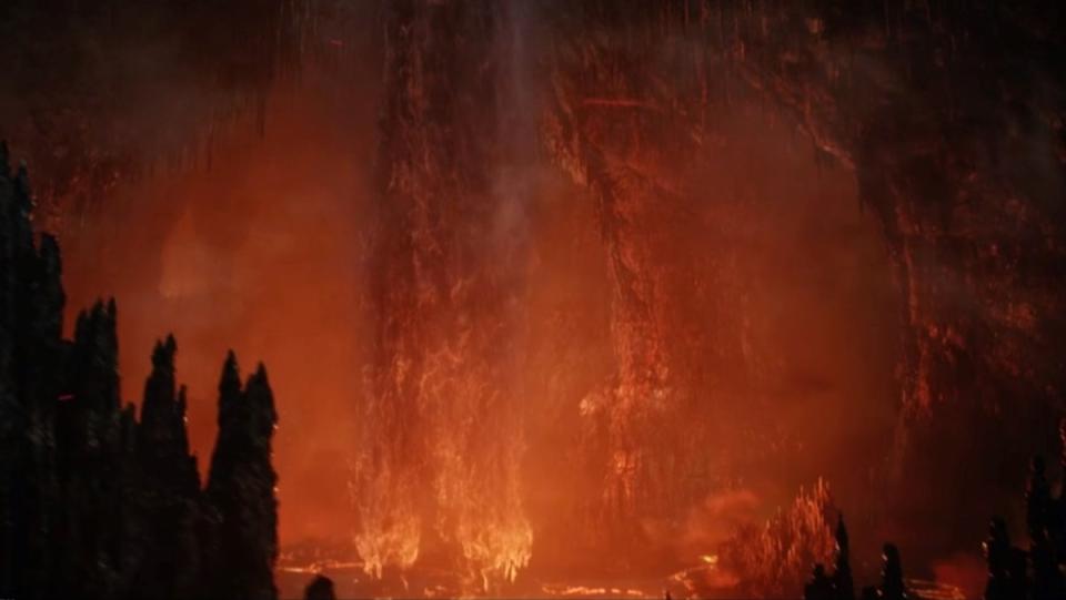 Water falls into a pool of lava in The Rings of Power