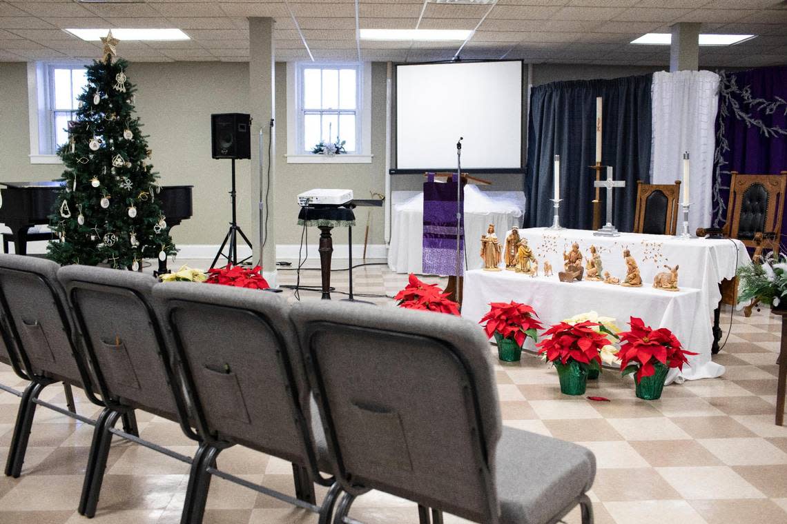 Members of the Woodland Christian Church are meeting in a smaller room on the lower levels of the building in Lexington, Ky., Friday, December 16, 2022. The church is planning a partnership with Winterwood Incorporated to create affordable elder apartments and renovate the 100-year-old building.