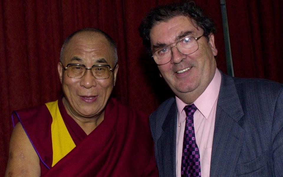 The Dalai Lama meeting fellow Nobel peace laureate John Hume - PA