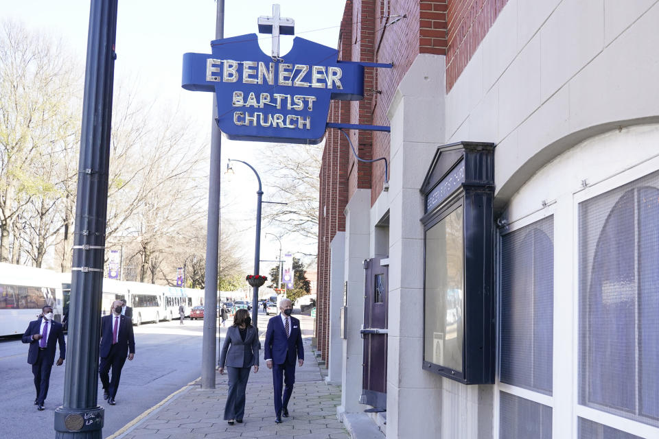 President Joe Biden and Vice President Kamala Harris walk as they arrive for a visit to Ebenezer Baptist Church, Tuesday, Jan. 11, 2022, in Atlanta. (AP Photo/Patrick Semansky)