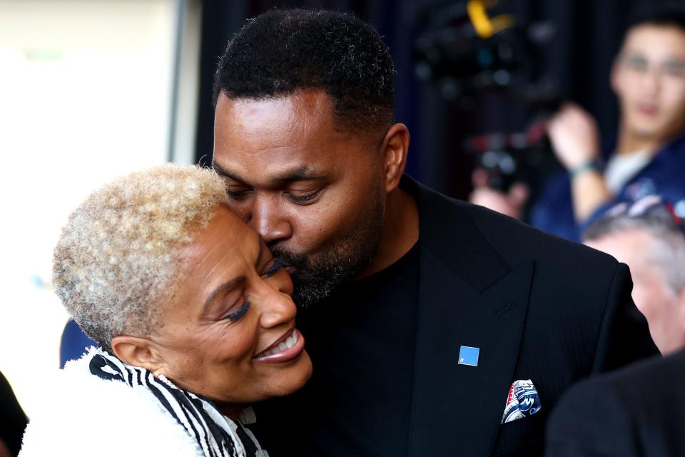 FOXBOROUGH, MASSACHUSETTS - JANUARY 17: Newly appointed head coach Jerod Mayo of the New England Patriots kisses his mother Denise Mayo-Hinds following a press conference at Gillette Stadium on January 17, 2024 in Foxborough, Massachusetts. (Photo by Maddie Meyer/Getty Images)