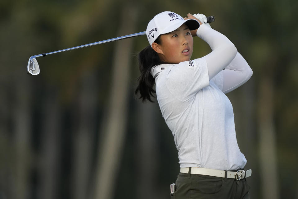 Ruoning Yin, of China, hits from the 18th fairway during the first round of the LPGA CME Group Tour Championship golf tournament, Thursday, Nov. 16, 2023, in Naples, Fla. (AP Photo/Lynne Sladky)