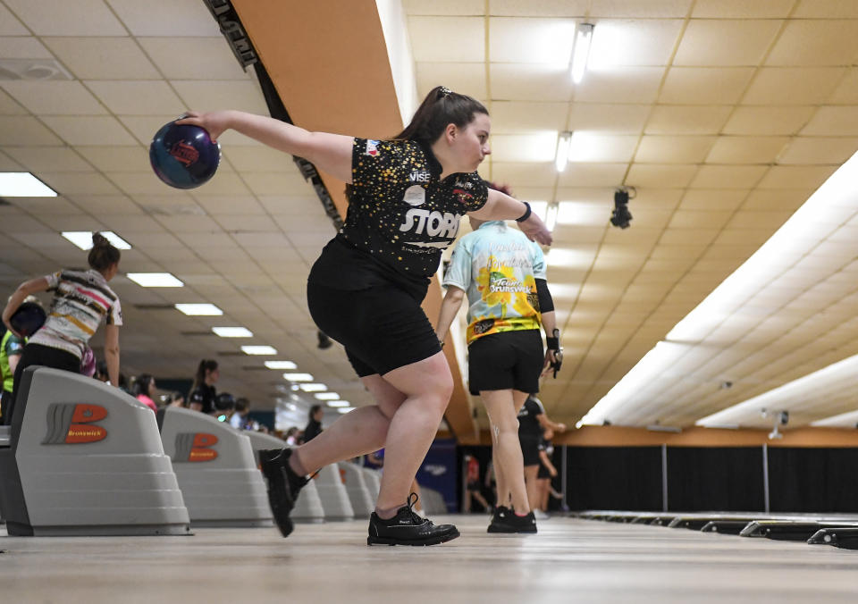 Maria Bulanova, a member of the Professional Women's Bowling Association and an assistant coach at St. Francis College, practices at Kingpin's Alley and Family Center, Wednesday, June 15, 2022, in Glens Falls, N.Y. Title IX has opened the door for thousands of female athletes from abroad to get an American education and a shot at a life and career in the United States. (AP Photo/Hans Pennink)