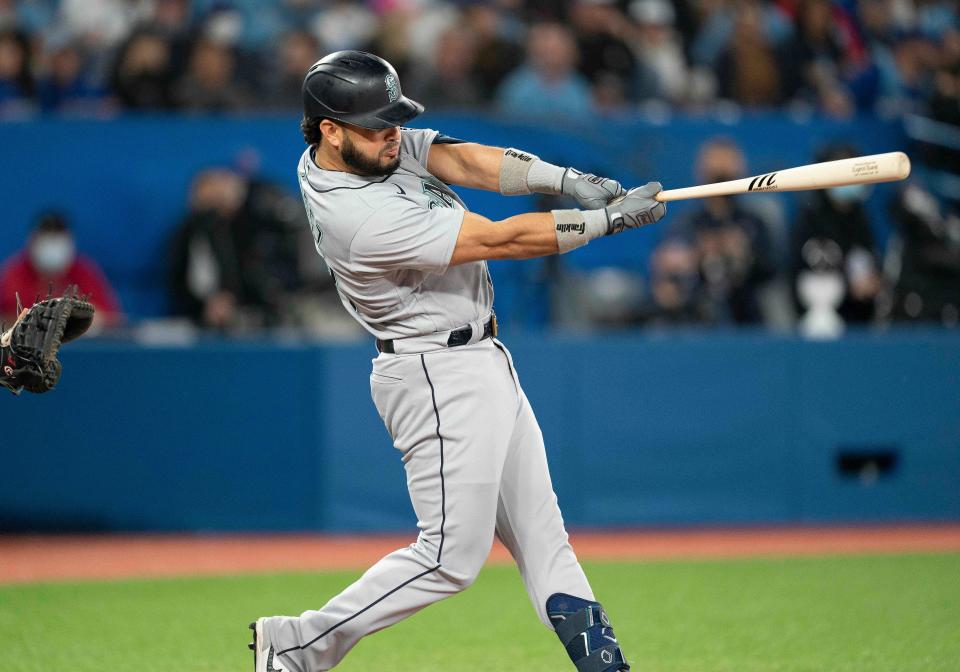 Seattle Mariners third baseman Eugenio Suarez (28) hits a home run against the Toronto Blue Jays during the seventh inning at Rogers Centre on May 16, 2022.