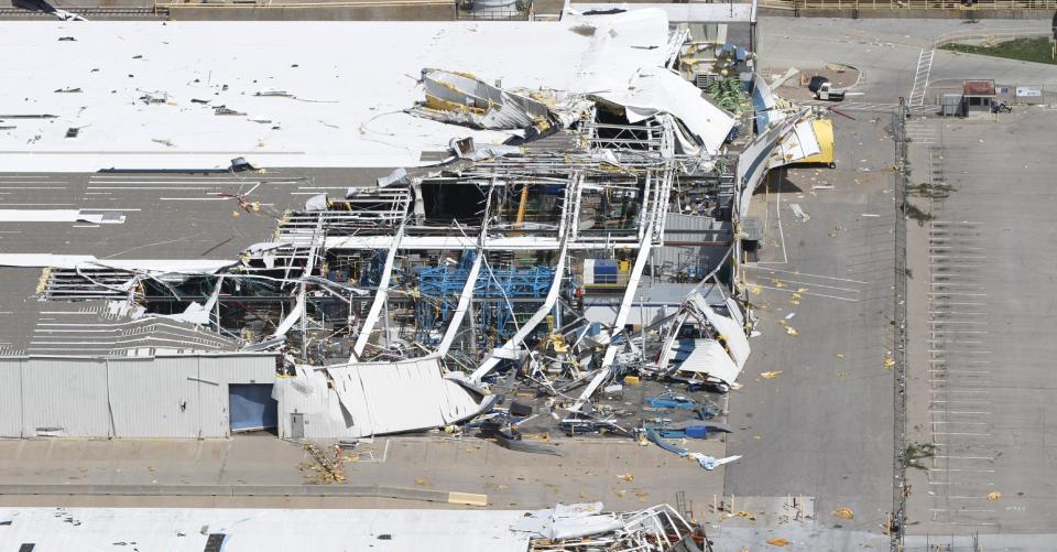 An aerial view shows the damage to Spirit Aerosystems from Saturday's tornado in Wichita, Kan., Sunday, April, 15, 2012. The massive storm system that plowed through Kansas this weekend damaged businesses, uprooted trees, caused power outages and upended about 100 homes in a Wichita mobile home park. But no serious injuries or fatalities were reported, which one authority called "pretty much a miracle." (AP Photo/Jeff Tuttle)