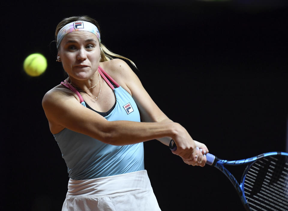 Sofia Kenin of USA in action against Anett Kontaveit of Estonia, during their WTA Tour Ladies Singles Round of 16 tennis match at the Porsche Arena in Stuttgart, Germany, Wednesday April 21, 2021. (Thomas Kienzle/Pool via AP)