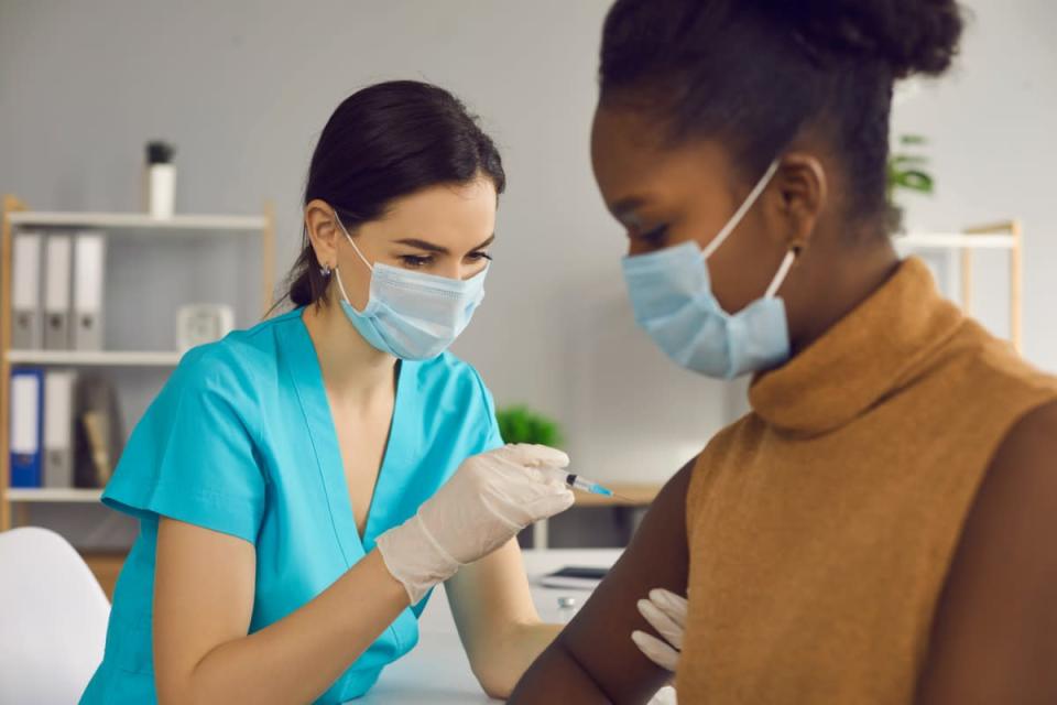 Woman getting COVID-19 vaccine shot.