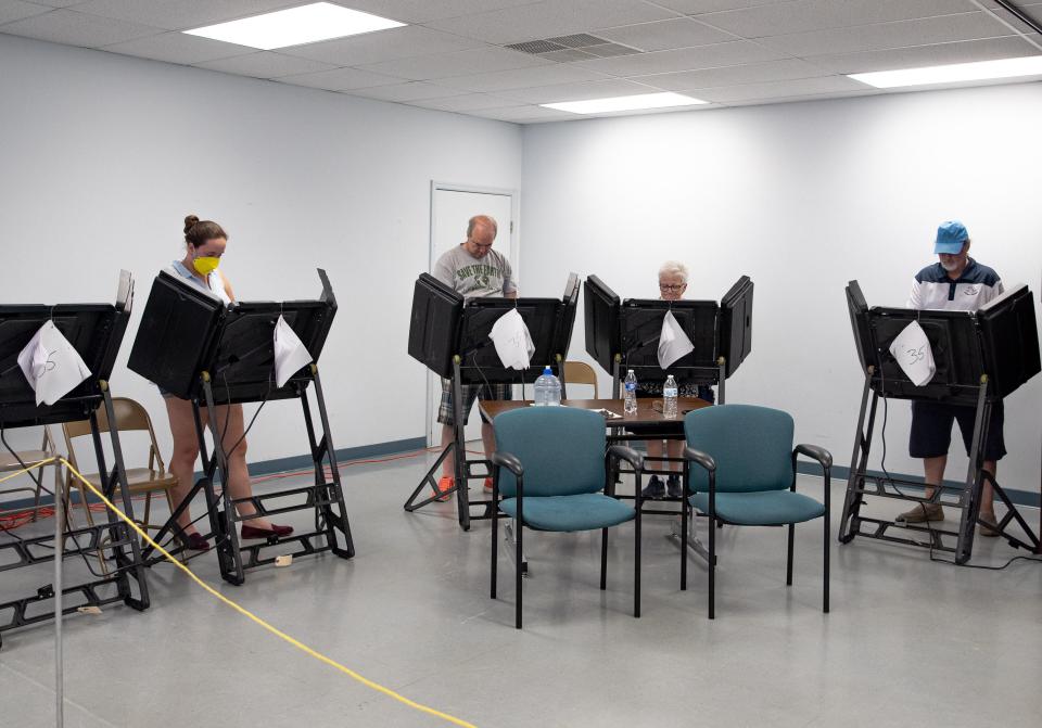 Voters cast their ballots during early voting in Columbia, TN. 