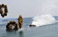 A South Korean Marine amphibious assault vehicle motors toward the seashore during a joint landing operation by US and South Korean forces in Pohang, on April 26, 2013