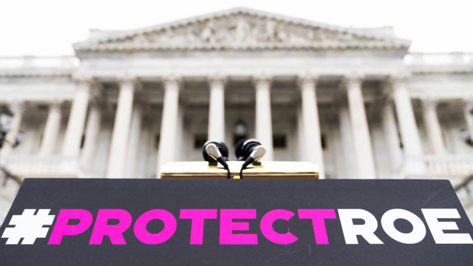 A sign reading Protect Roe on the steps of the U.S. Capitol.