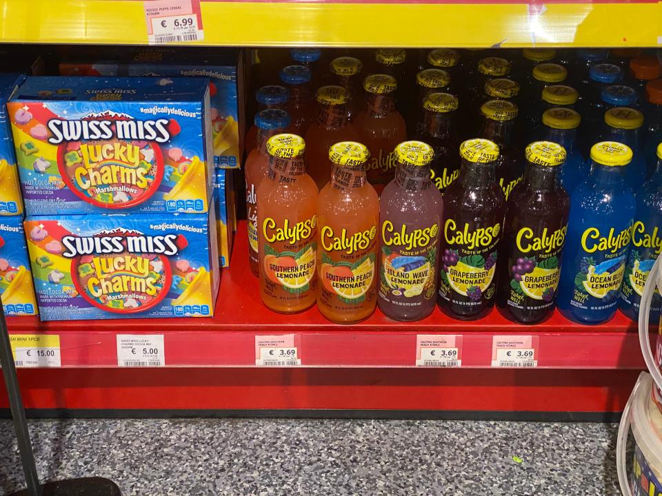 lucky charms hot chocolate and bottles of calypso on the shelf of an irish grocery store
