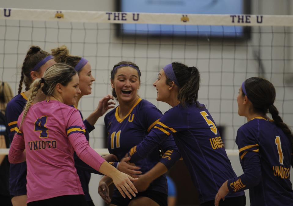 Unioto volleyball's Madelyn Wetzel (#5) celebrates with her teammates during the Shermans 3-2 win over the Adena Warriors on Sept. 26, 2023, at Unioto High School in Chillicothe, Ohio.
