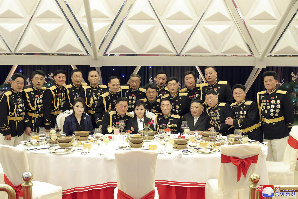 In this photo provided by the North Korean government, North Korean leader Kim Jong Un, fourth right in front, with his wife Ri Sol Ju, front left, and his daughter, center, poses with military top officials for a photo at a feast to mark the 75th founding anniversary of the Korean People’s Army at an unspecified place in North Korea Tuesday, Feb. 7, 2023. Independent journalists were not given access to cover the event depicted in this image distributed by the North Korean government. The content of this image is as provided and cannot be independently verified. Korean language watermark on image as provided by source reads: "KCNA" which is the abbreviation for Korean Central News Agency. (Korean Central News Agency/Korea News Service via AP)