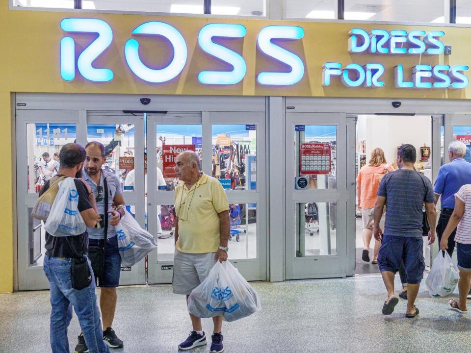 Shoppers stand in front of Ross Dress for Less discount retail store in Miami Beach, Florida.