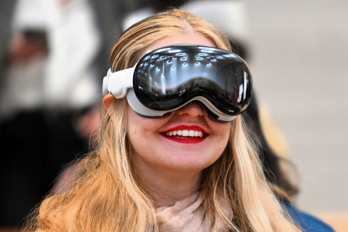 A customer tries on the Apple Vision Pro headset during the product release at the Apple Store in New York City on 2 February, 2024 (Getty Images)