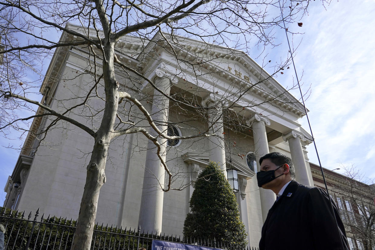 A member of the U.S. Secret Service stands guard outside Holy Trinity Catholic Church as President Joe Biden attends mass, Sunday, Jan. 24, 2021, in the Georgetown neighborhood of Washington. (AP Photo/Patrick Semansky)