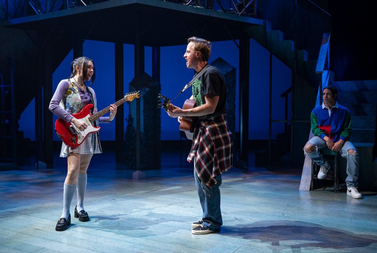 Katrien Van Riel and Will Mobley jam as Kenneth Hamilton listens in Shakespeare's "Much Ado About Nothing," staged by Milwaukee Repertory Theater. Music director Dan Kazemi has composed grunge-flavored music for the production.