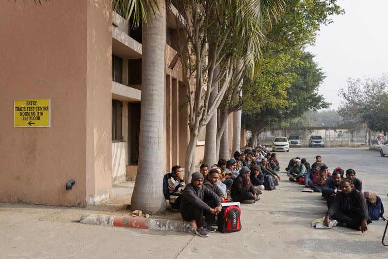Skilled workers wait for their interview and skill test at a Haryana state government recruitment drive to send workers to Israel, at Maharshi Dayanand University in Rohtak