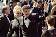 <p>Burt Reynolds waves to fans as he arrives at the Emmy Awards. The actor was nominated for Outstanding Lead Actor in the show <em>Evening Shade</em>.</p>