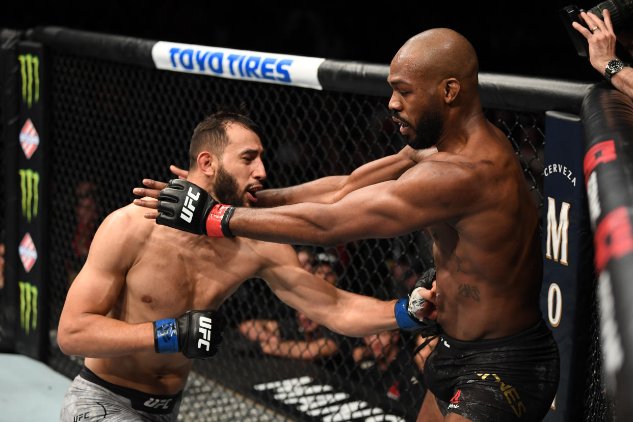 HOUSTON, TEXAS - FEBRUARY 08:  (L-R) Dominick Reyes punches Jon Jones in their light heavyweight championship bout during the UFC 247 event at Toyota Center on February 08, 2020 in Houston, Texas. (Photo by Josh Hedges/Zuffa LLC via Getty Images)