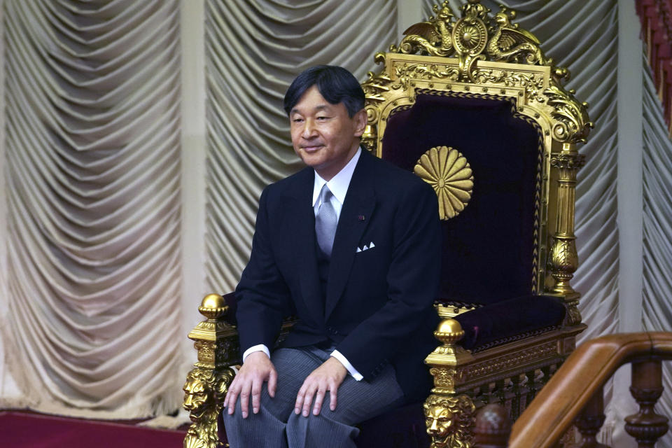 Japan's Emperor Naruhito sits after opening formally an extraordinary session at the upper house of parliament in Tokyo Thursday, Aug. 1, 2019. Naruhito delivered his first opening speech since ascending to the Chrysanthemum Throne on May 1. (AP Photo/Eugene Hoshiko)