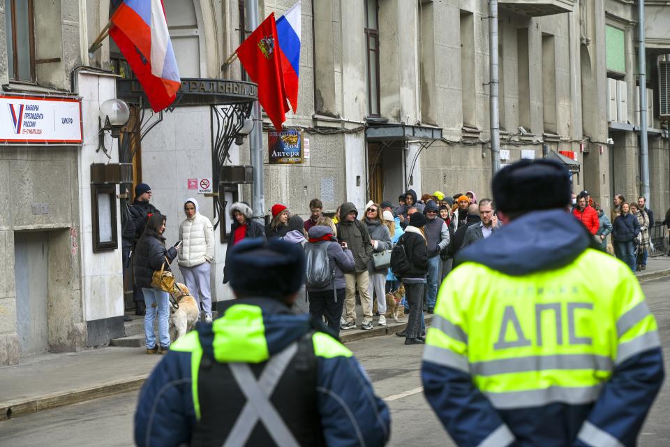 Voters queue at a polling station at noon local time in Moscow, Russia, on Sunday, March 17, 2024. The Russian opposition has called on people to head to polling stations at noon on Sunday in protest as voting takes place on the last day of a presidential election that is all but certain to extend President Vladimir Putin's rule after he clamped down on dissent. AP can't confirm that all the voters seen at the polling station at noon were taking part in the opposition protest. (AP Photo)