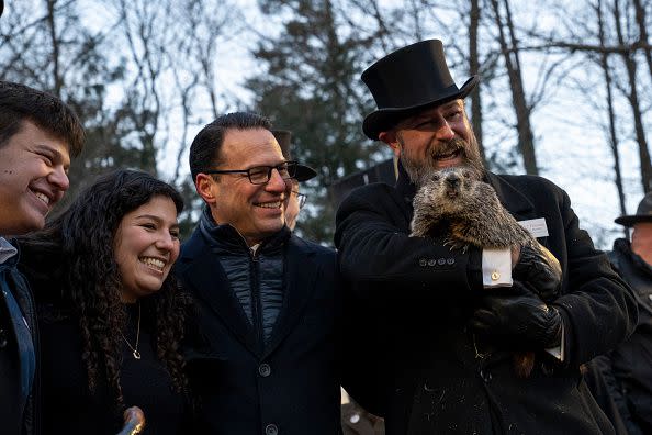 PUNXSUTAWNEY, PA - FEBRUARY 02: Pennsylvania Governor Josh Shapiro and his children pose for a portrait with Groundhog handler AJ Derume and Punxsutawney Phil, who saw his shadow, predicting a late spring during the 136th annual Groundhog Day festivities on February 2, 2023 in Punxsutawney, Pennsylvania. Groundhog Day is a popular tradition in the United States and Canada. A crowd of upwards of 5,000 people spent a night of revelry awaiting the sunrise and the groundhog's exit from his winter den. If Punxsutawney Phil sees his shadow he regards it as an omen of six more weeks of bad weather and returns to his den. Early spring arrives if he does not see his shadow, causing Phil to remain above ground.
 (Photo by Michael Swensen/Getty Images)