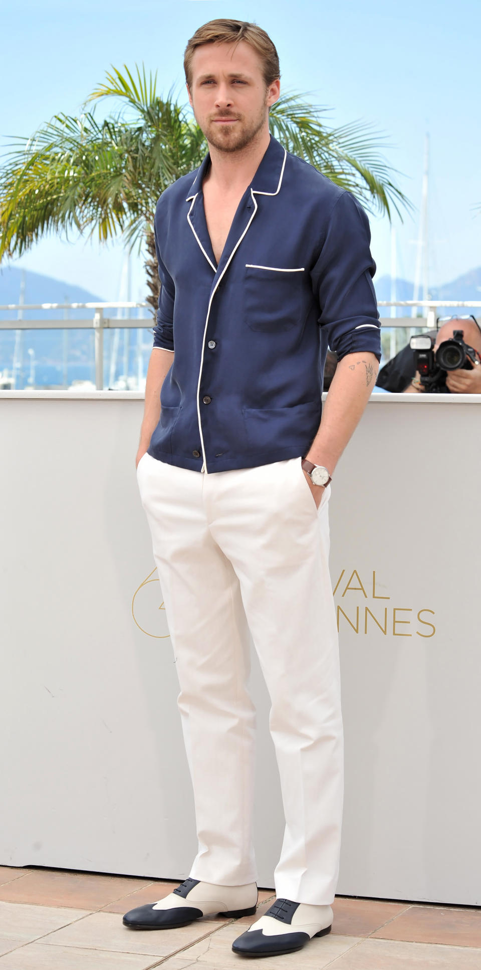 <p>The Hollywood dreamboat attended Cannes Film Festival in a navy pajama-esque top (shop a similar look <a rel="nofollow noopener" href="http://www.barneys.com/product/derek-rose-lombard-modern-fit-pajama-top--26-pants-504538804.html?" target="_blank" data-ylk="slk:here;elm:context_link;itc:0;sec:content-canvas" class="link ">here</a>), white pants, and tuxedo dress shoes. </p>