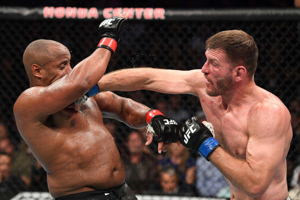 ANAHEIM, CALIFORNIA - AUGUST 17:  (R-L) Stipe Miocic punches Daniel Cormier in their heavyweight championship bout during the UFC 241 event at the Honda Center on August 17, 2019 in Anaheim, California. (Photo by Josh Hedges/Zuffa LLC/Zuffa LLC via Getty Images)