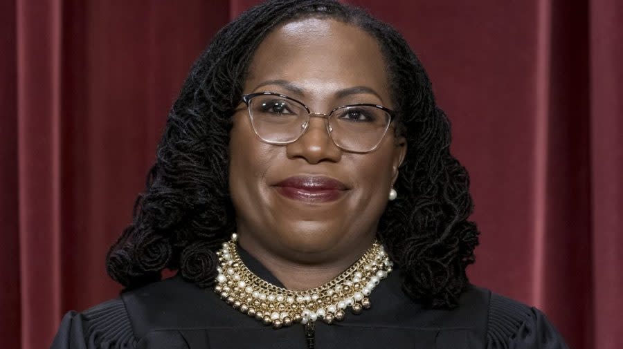 FILE - Associate Justice Ketanji Brown Jackson stands as she and members of the Supreme Court pose for a new group portrait following her addition, at the Supreme Court building in Washington, Oct. 7, 2022. (AP Photo/J. Scott Applewhite, File)