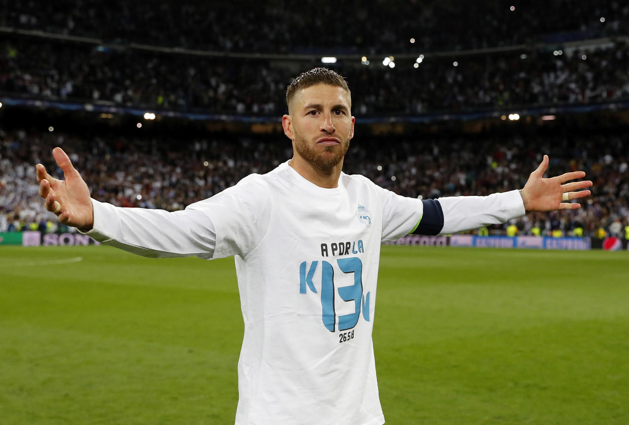 Sergio Ramos celebrates Real Madrid’s Champions League semifinal victory over Bayern Munich. After the final whistle, Madrid players were given shirts that looked ahead to a possible 13th European title. (Getty)