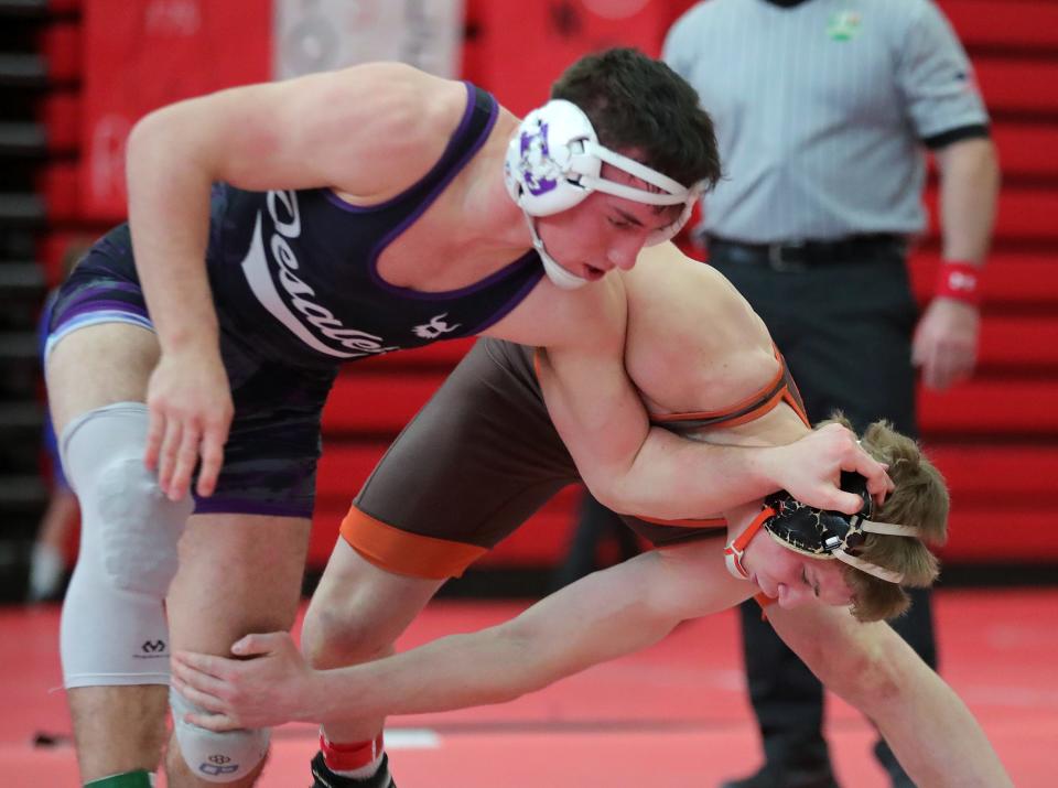 Eddie Neitenbach of Buckeye, right, wrestles Lincoln Shulaw of St. Francis Desales during their 190 pound match in the semifinals of the Wadsworth Grizzly Invitational Tournament, Saturday, Jan. 20, 2024, in Wadsworth, Ohio.