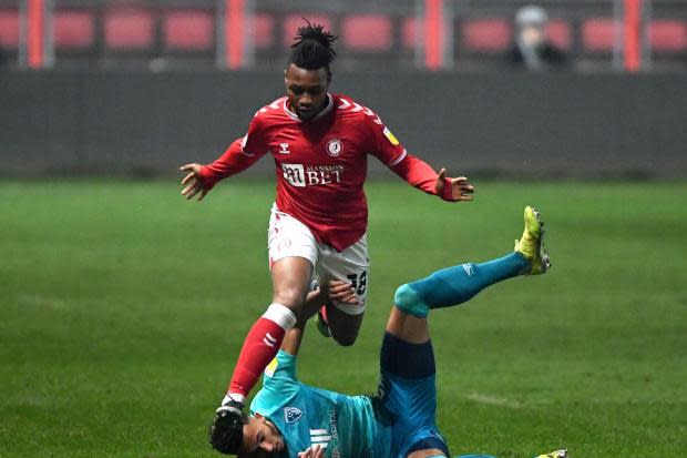 Bristol City's Antoine Semenyo (top) and AFC Bournemouth's Lloyd Kelly battle for the ball during the Sky Bet Championship match Ashton Gate, Bristol. Picture date: Wednesday March 3, 2021. PA Photo. See PA story SOCCER Bristol City. Photo credit
