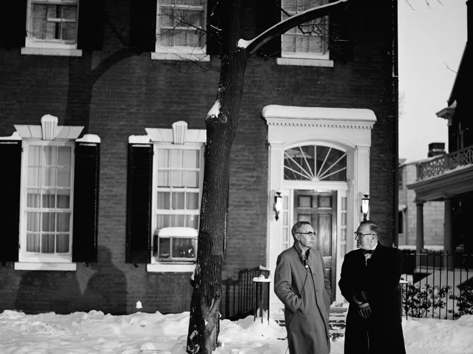 NBC News' Dave Garroway interviews Pat McMahon, whom John F. Kennedy saved in World War II, outside Kennedy's home at 3307 N Street in Georgetown.