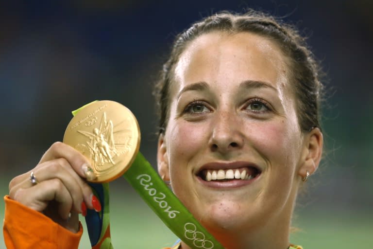 Gold medallist Elis Ligtlee poses with her medal on the podium after the women's keirin finals track cycling event on August 13, 2016