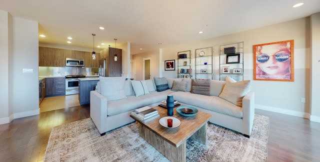 The three-bedroom condo in the Citron Modern Living complex expands to a balcony overlooking the neighborhood.