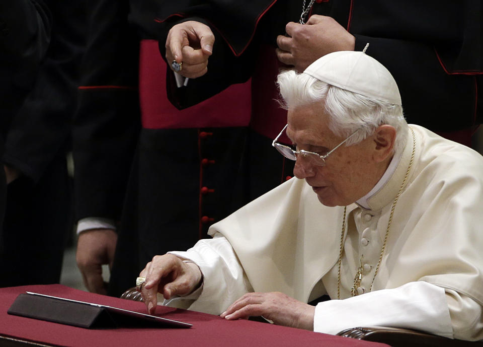 Pope Benedict XVI pushes a button on a tablet at the Vatican, Wednesday, Dec. 12, 2012. Pope Benedict XVI hit the 1 million Twitter follower mark on Wednesday as he sent his first tweet from his new account, blessing his online fans and urging them to listen to Christ. In perhaps the most drawn out Twitter launch ever, the 85-year-old Benedict pushed the button on a tablet brought to him at the end of his general audience after the equivalent of a papal drum roll by an announcer who intoned: "And now the pope will tweet!" "Dear friends, I am pleased to get in touch with you through Twitter. Thank you for your generous response. I bless all of you from my heart," the inaugural tweet read. (AP Photo/Gregorio Borgia)