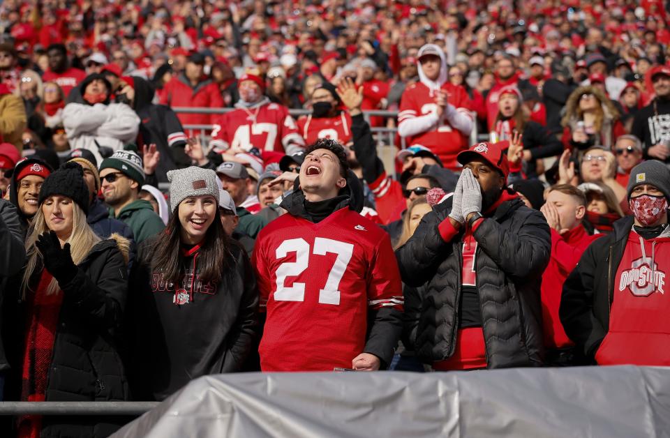 Ohio State Buckeyes fans cheer during the first quarter of the NCAA football game against the Michigan State Spartans at Ohio Stadium in Columbus on Saturday, Nov. 20, 2021. 